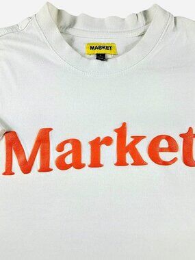white chinatown Market tee with orange puff print lettering